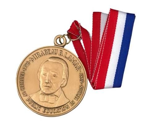 The Mirabeau B. Lamar medal with a red, white, and blue ribbon, inscribed Father of Public Education in Texas